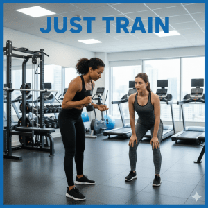 Two women train in a gym, with one holding a dumbbell and the other in a workout stance.